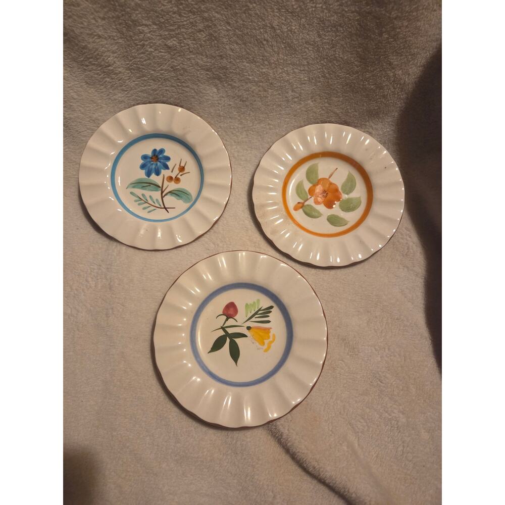 3 stangle bread plates 3 patterns small chips on back see photos